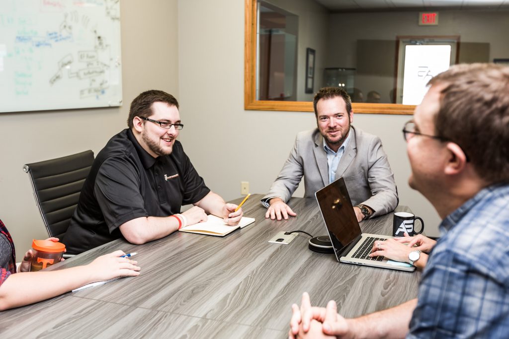 Three people sitting at a table