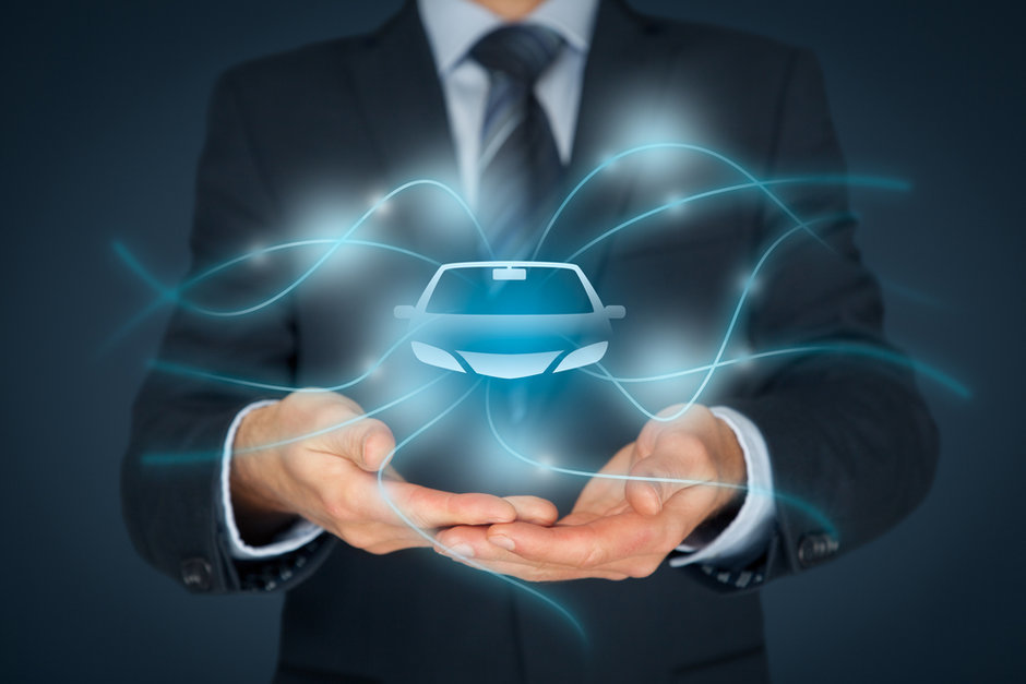 Stock photo of man holding graphic of a vehicle with waves surrounding it