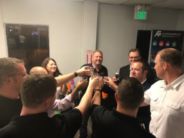 Group of people raising glasses