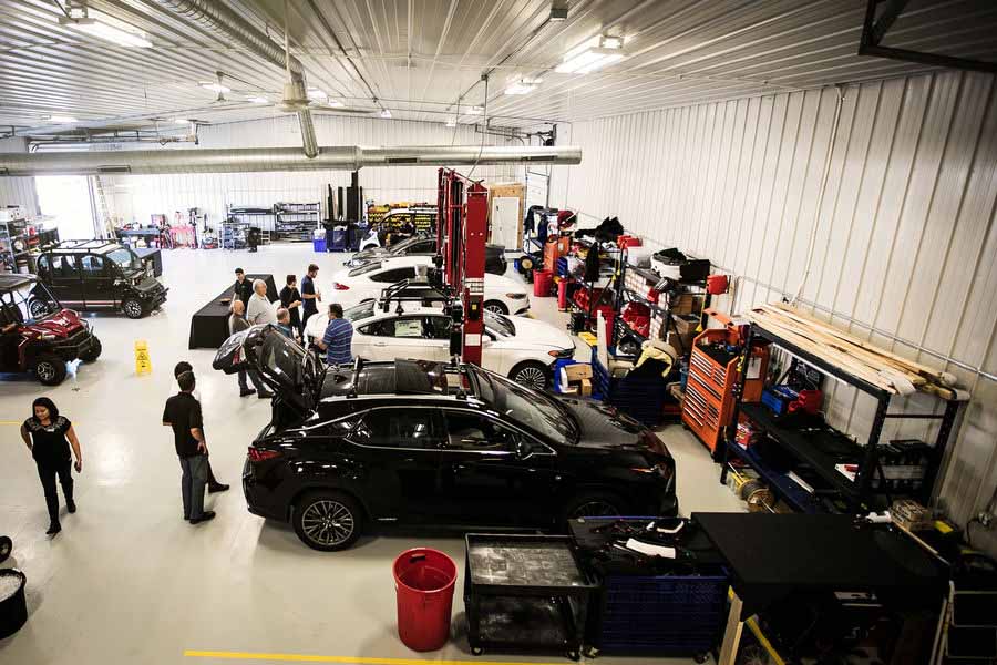 Birds eye view of shop with several vehicles