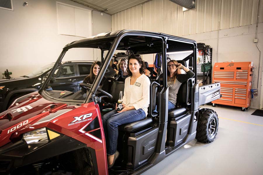 Woman sitting inside a Polaris Ranger