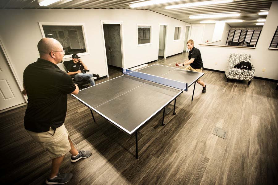 Two men playing table tennis