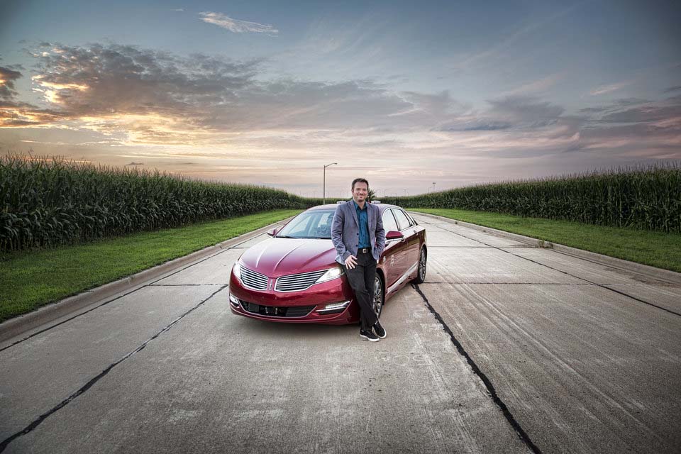 Man standing in front of a car