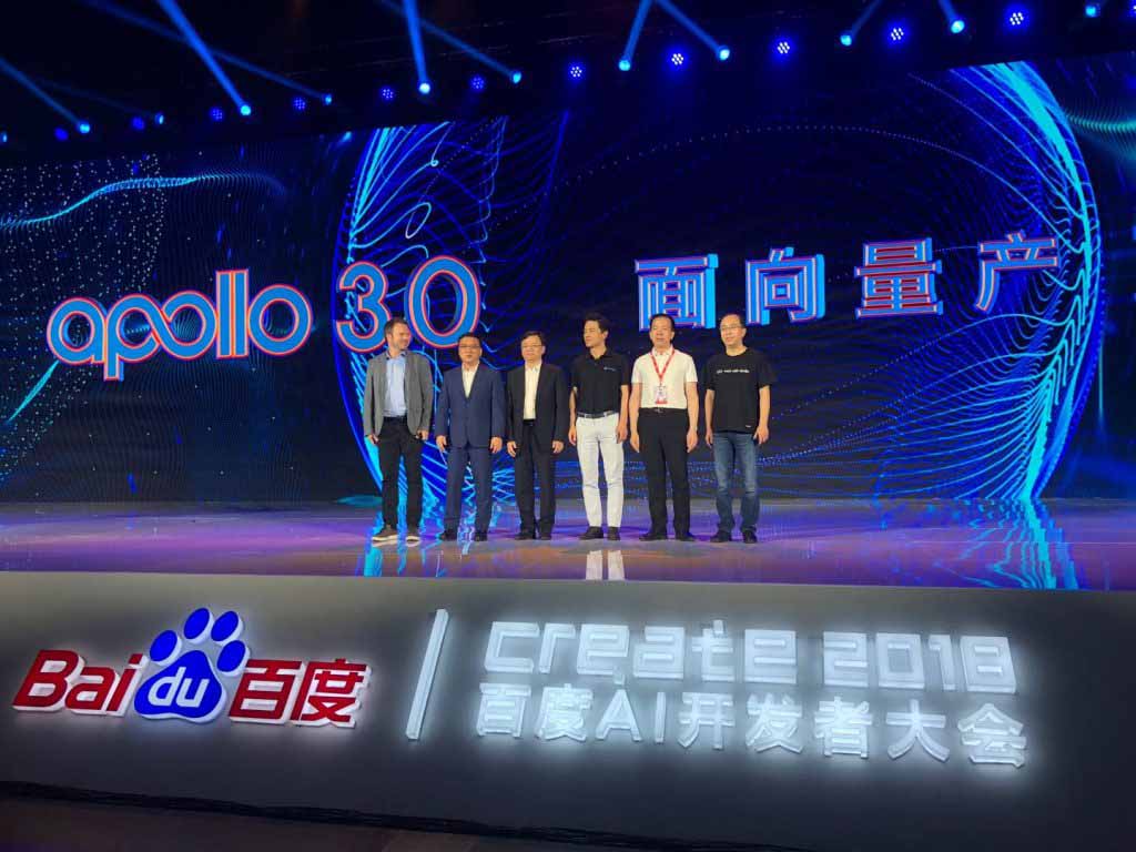 Six people standing on a stage