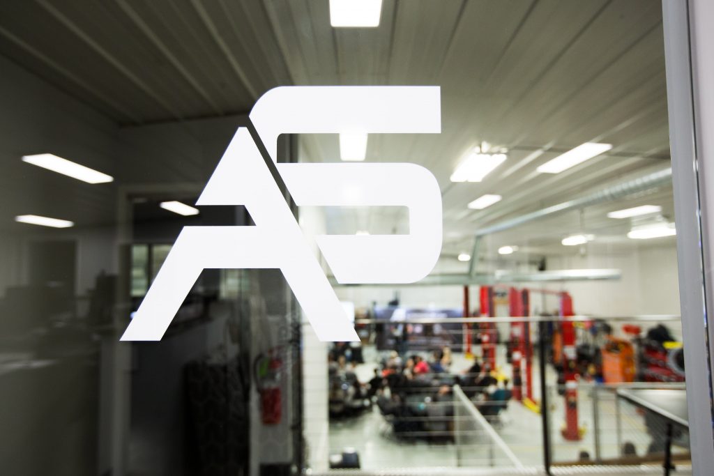 AS logo on a glass door leading into a shop