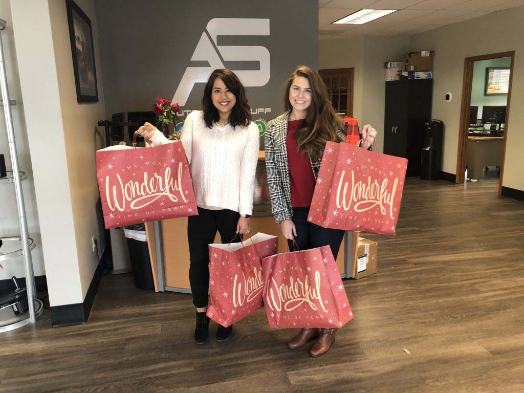 Two women holding bags
